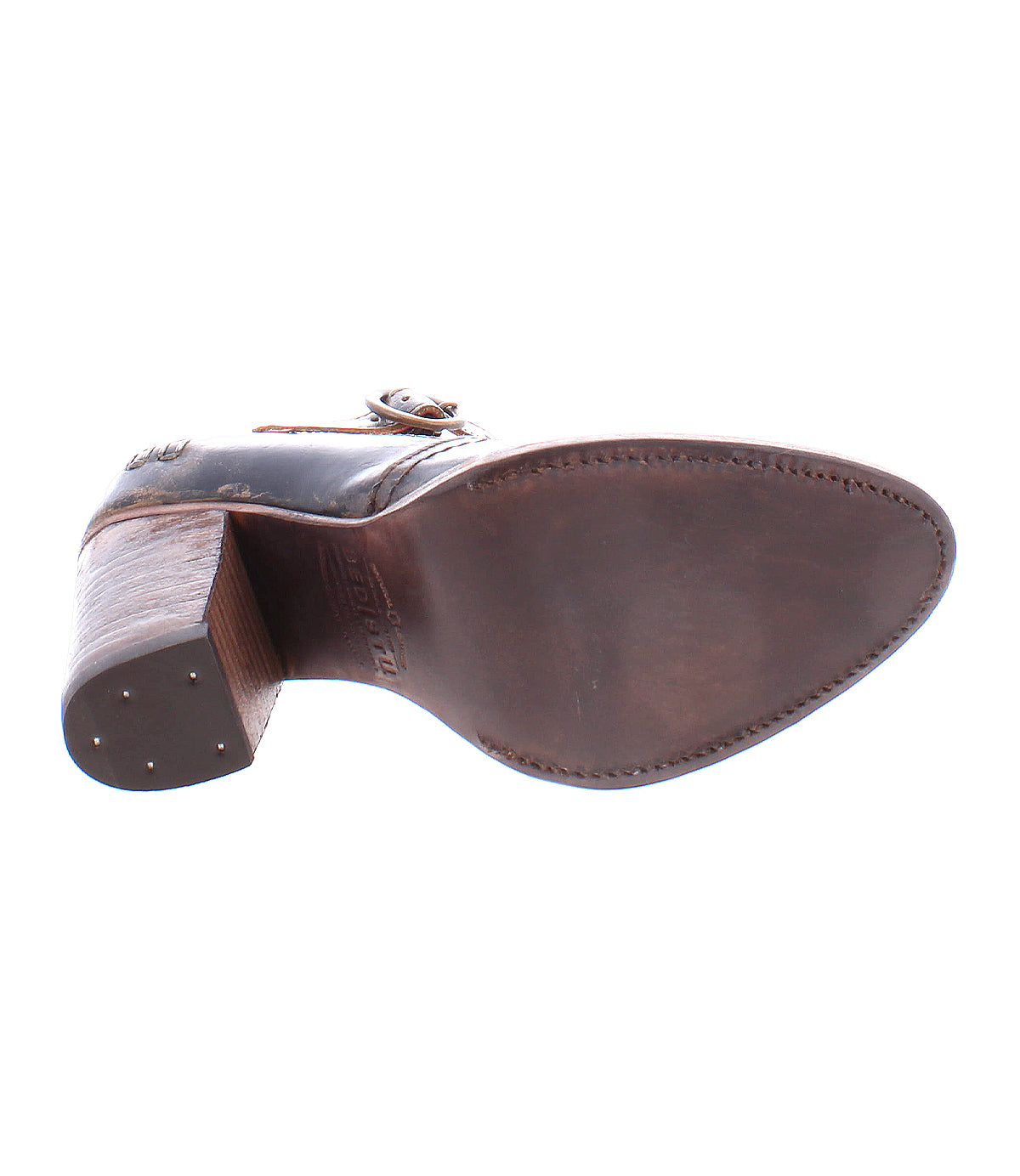 The image shows the bottom view of the Bed|Stü Ishtar brown leather Mary Jane pump, featuring a wooden sole with visible edge stitching and a sturdy block heel.