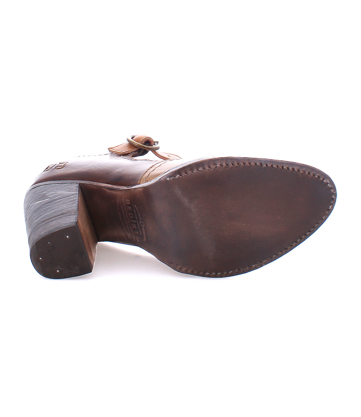 The Bed|Stü Ishtar is shown from the sole, highlighting its smooth bottom, stacked block heel, adjustable strap, and visible edge stitching.