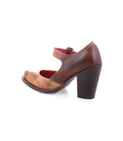 The Bed|Stü Ishtar is a brown leather Mary Jane pump with a single adjustable strap and a chunky block heel, shown from the side against a white background.