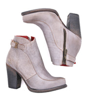 A pair of Bed|Stü Isla ankle boots in light brown smooth leather, featuring side zippers, chunky heels, and buckled straps, displayed on a white background.