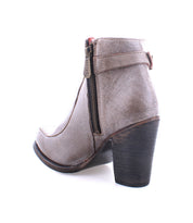 Side view of the Bed|Stü Isla ankle boot in taupe smooth leather, featuring a side zipper, visible stitching, and a chunky dark wooden heel, photographed on a white background.