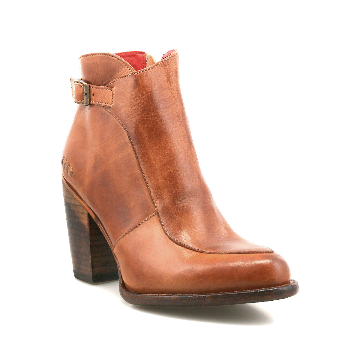 Introducing the Isla bootie by Bed|Stü—a brown, smooth leather heeled bootie featuring a medium stacked heel, side buckle detail, and a slightly pointed toe, displayed on a white background.