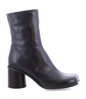 The Isodora by Bed|Stü is a black Italian leather ankle boot featuring a round toe and chunky high heel, handcrafted with Blake-stitched construction and shown in a side view against a plain white background.