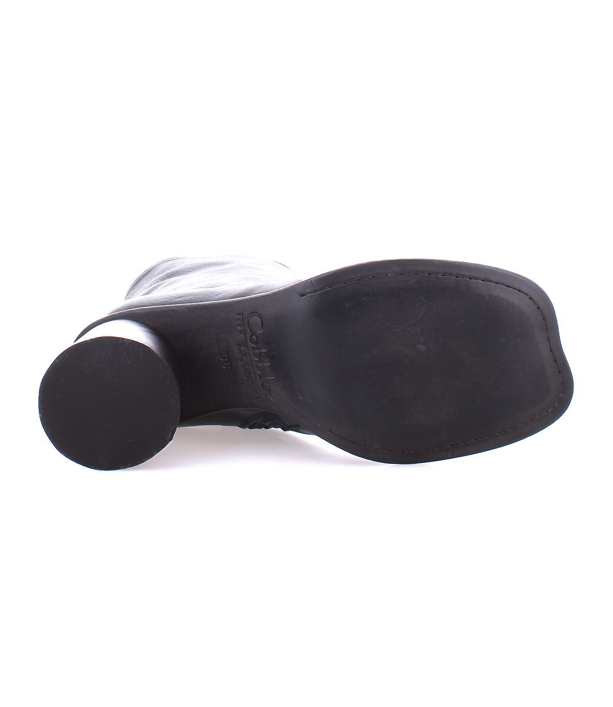 An elegant example of handcrafted footwear, the Isodora boot by Bed|Stü is shown in black, lying on its side to display the sole and heel against a white background.