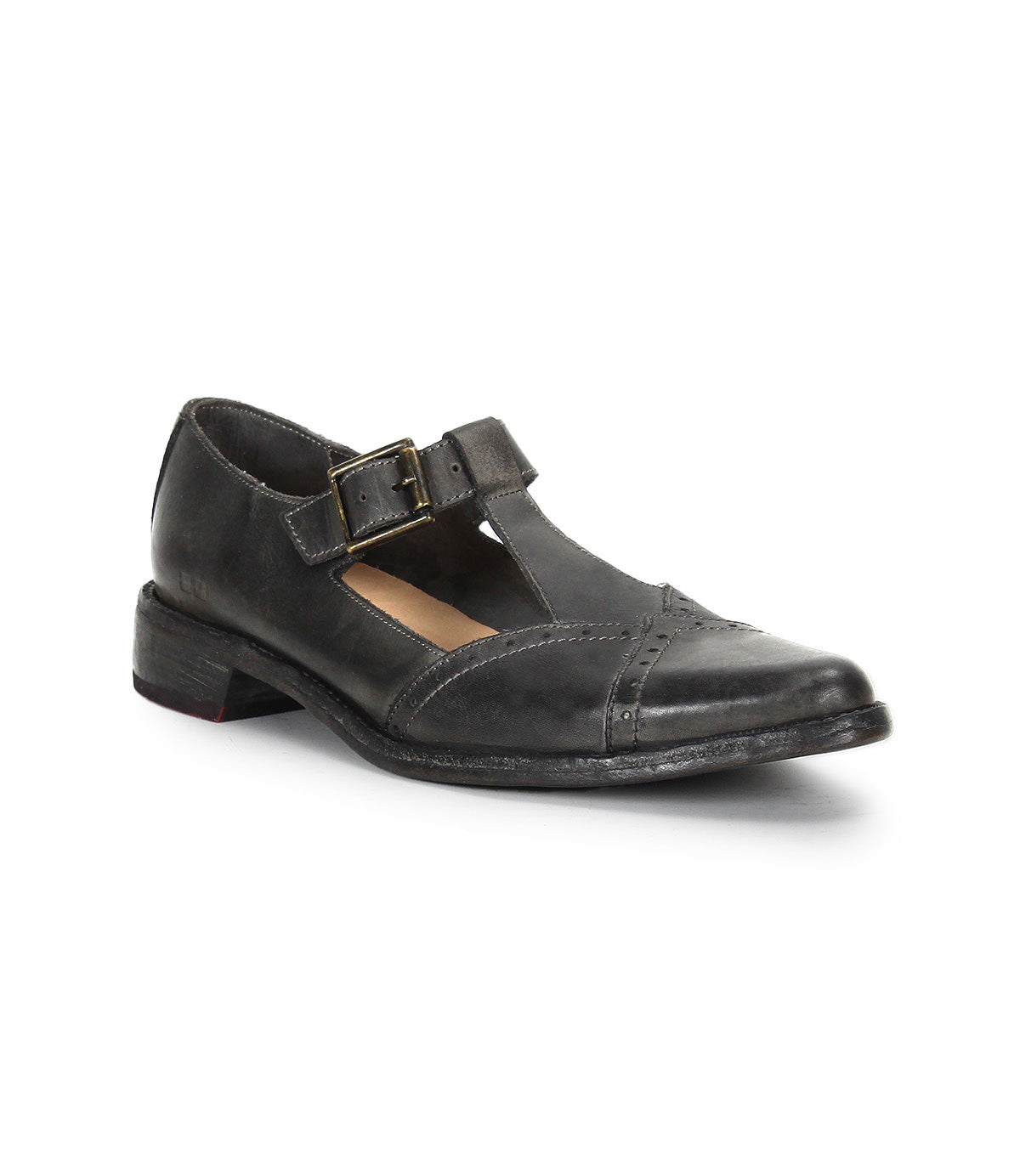 The Bed|Stü Jenny is a black leather Mary Jane T-strap shoe featuring a low heel, cushioned insole, buckle closure, and round toe, shown on a white background.