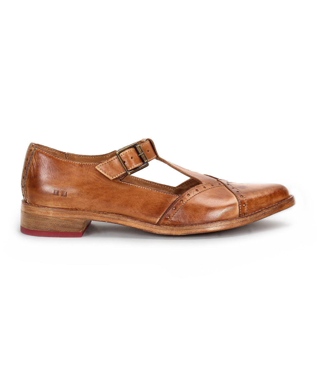 The Bed|Stü Jenny is a single brown leather Mary Jane-style T-strap shoe featuring a double buckle, low heel, cushioned insole, and red detailing on the outsole, displayed in profile against a white background.