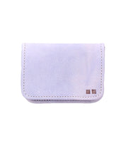 Introducing Jeor by Bed|Stü—a compact, rectangular white fabric wallet featuring visible stitching and two small metal accents in the bottom right corner. This stylish pouch combines practicality and elegance, making it perfect for carrying your essentials with ease.
