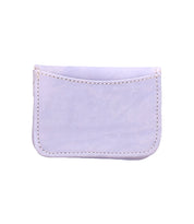 The Bed|Stü Jeor is a small, rectangular wallet crafted from light purple fabric, featuring visible stitching and an open top flap, designed with convenient credit card slots for compact everyday use.