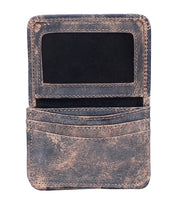 The Bed|Stü Jeor is a worn brown rustic leather card wallet, featuring an ID window and two credit card slots, shown open and empty against a white background.