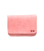 Introducing the Jeor card wallet by Bed|Stü—a compact, rectangular accessory crafted from light pink rustic leather. Its visible stitching and two small square accents in the bottom right corner add a subtle touch of character. Designed with convenient credit card slots, the Jeor wallet perfectly balances thoughtful functionality with an elegant, minimalist style.