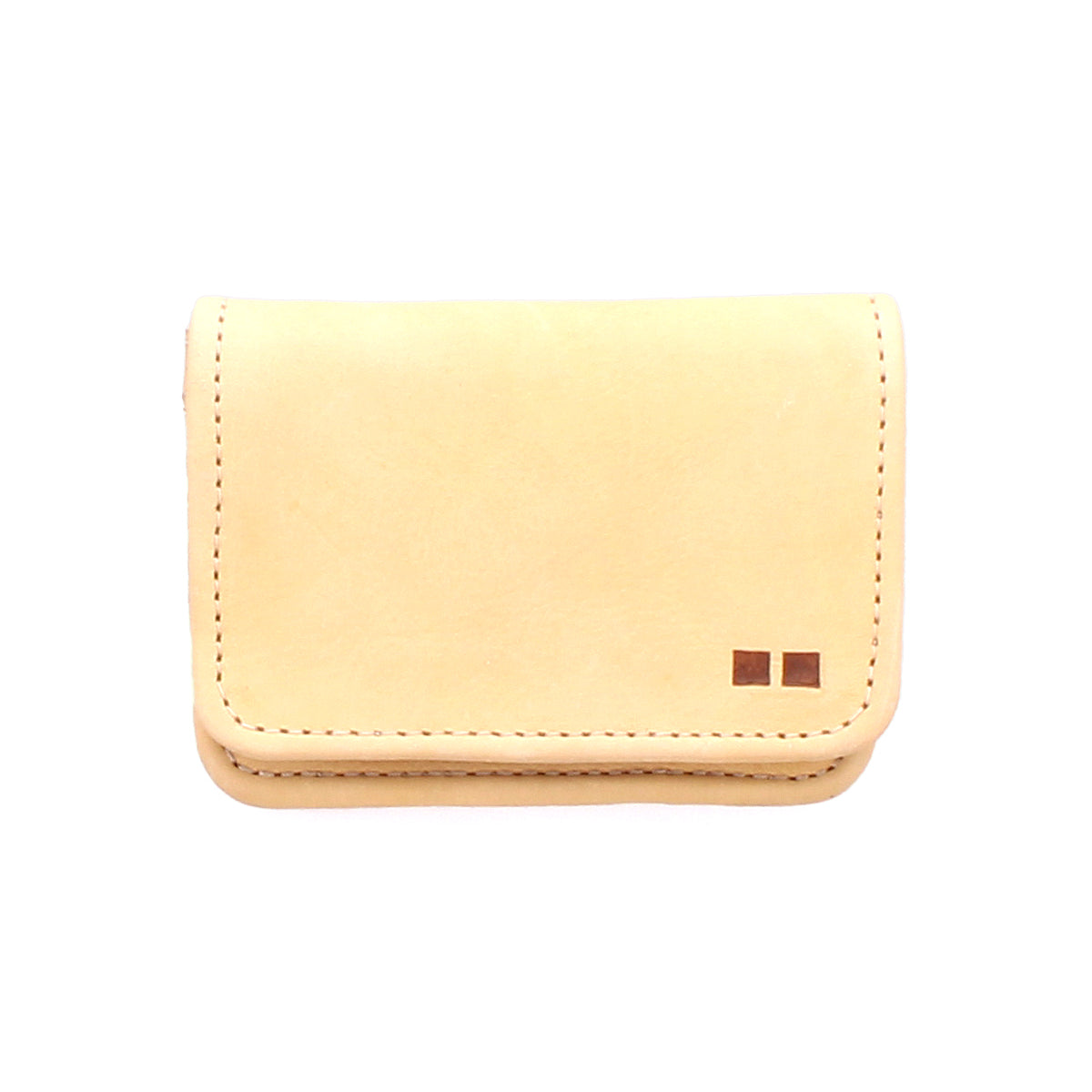 A small, beige rustic leather card wallet, the Jeor by Bed|Stü, featuring two small square accents in the bottom right corner, photographed on a white background.