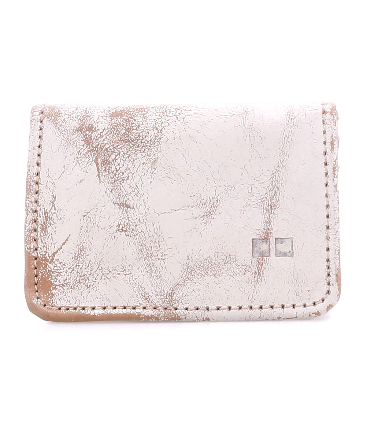 Introducing the Jeor by Bed|Stü—a compact, rustic leather card wallet in a light hue, distinguished by its visible creases and scuffs for authentic vintage appeal. Two small square metal accents adorn the front, while convenient credit card slots ensure easy organization without compromising style.