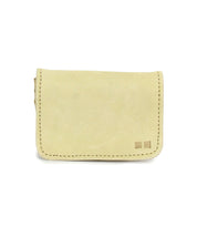 Introducing the Jeor compact wallet by Bed|Stü: a small rectangular wallet crafted from beige suede with visible stitching and two distinctive square accents on the lower right corner, featuring convenient credit card slots. Photographed against a white background.