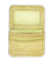 The Bed|Stü Jeor beige rustic leather card wallet is pictured open on a white background, revealing its transparent ID slot, two credit card slots, and a larger pocket—all empty. This compact wallet seamlessly combines minimalism with classic style.