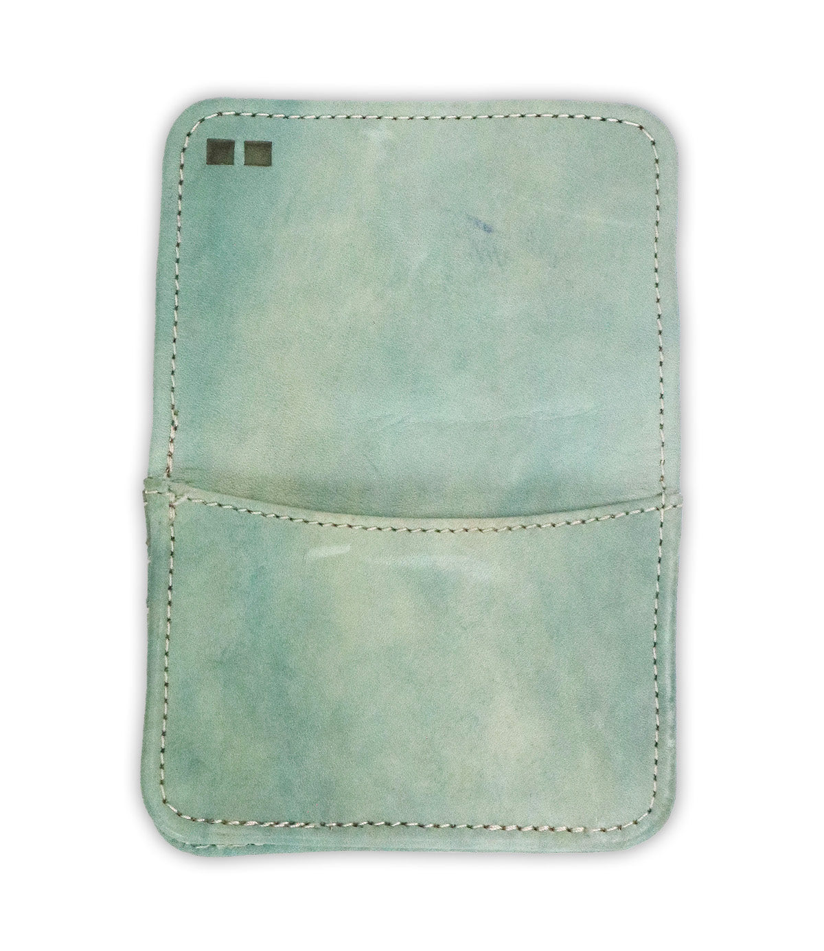 Introducing the Jeor card wallet by Bed|Stü—a light blue rustic leather wallet with white stitching. It features a single pocket and two small square markings in the upper left corner. This compact accessory is perfect for carrying your essentials in style.
