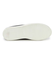 The image displays the bottom view of a white rubber sole from the Bed|Stü Joyce II, featuring a simple tread pattern and a distinctive small rectangular indentation in the center. This style typically includes a lace-up front for secure fitting.