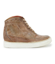 The Bed|Stü Joyce II is a brown leather high-top sneaker featuring a lace-up front with beige laces and a white rubber sole, displayed in side profile against a white background.