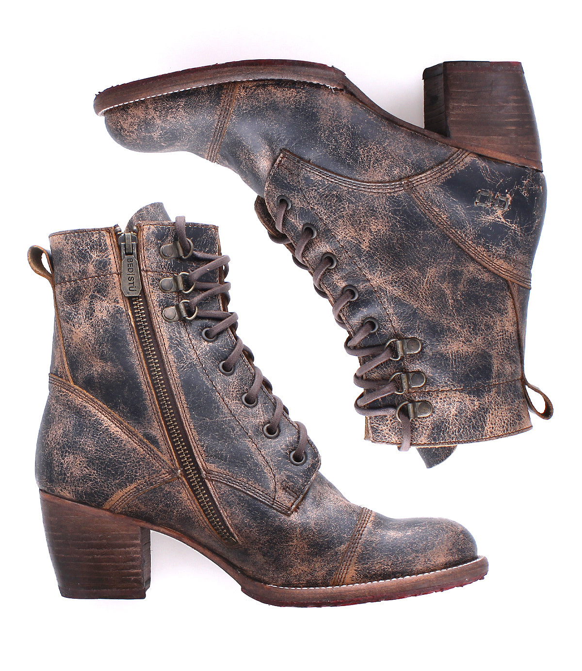 A pair of Bed|Stü Judgement brown leather lace-up ankle boots with cap toes, side zippers, and chunky stacked heels is shown against a white background.