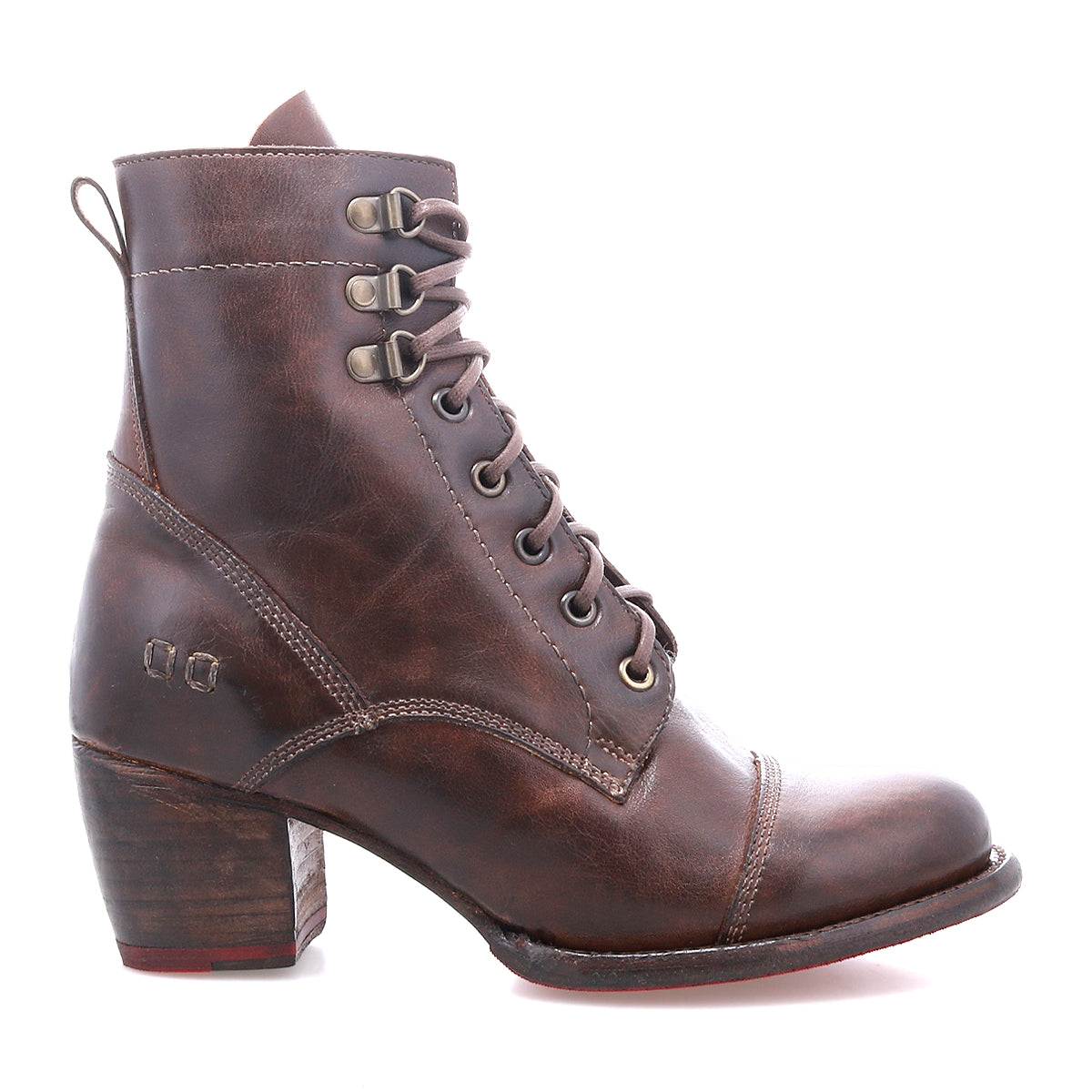 The Bed|Stü Judgement is a brown leather lace-up boot featuring a cushioned insole, chunky block heel, and pull tab, displayed in profile on a white background.