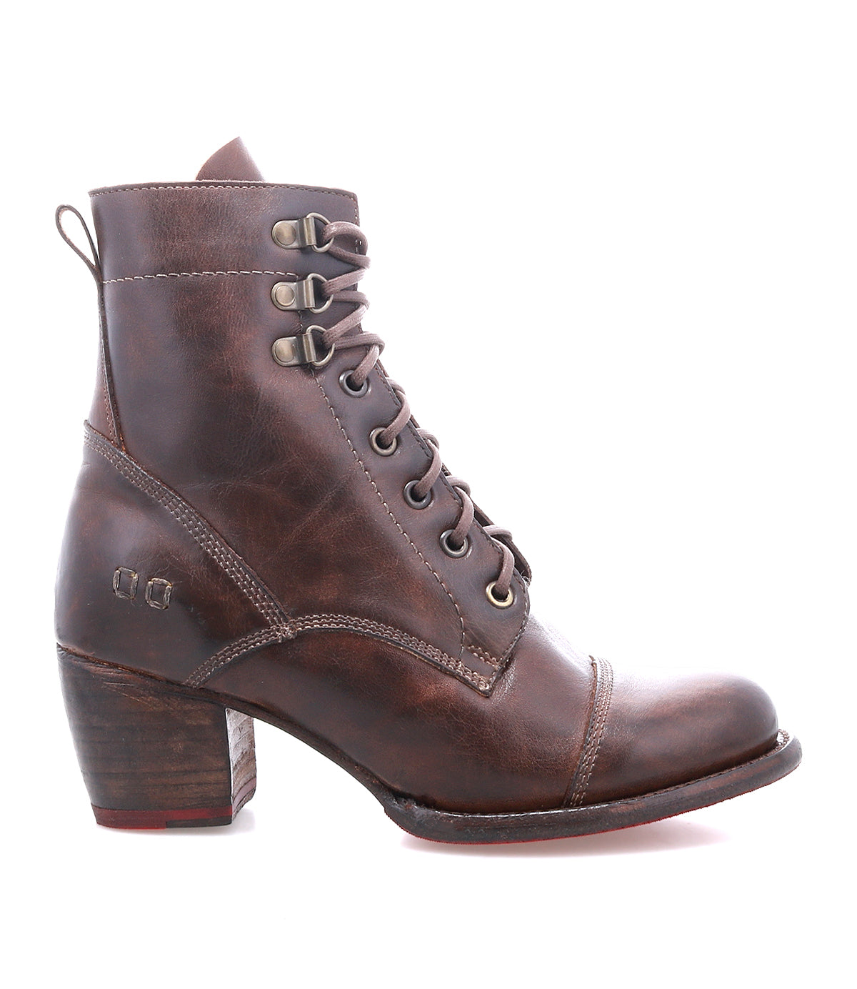 The Bed|Stü Judgement is a brown leather lace-up boot featuring a cushioned insole, chunky block heel, and pull tab, displayed in profile on a white background.