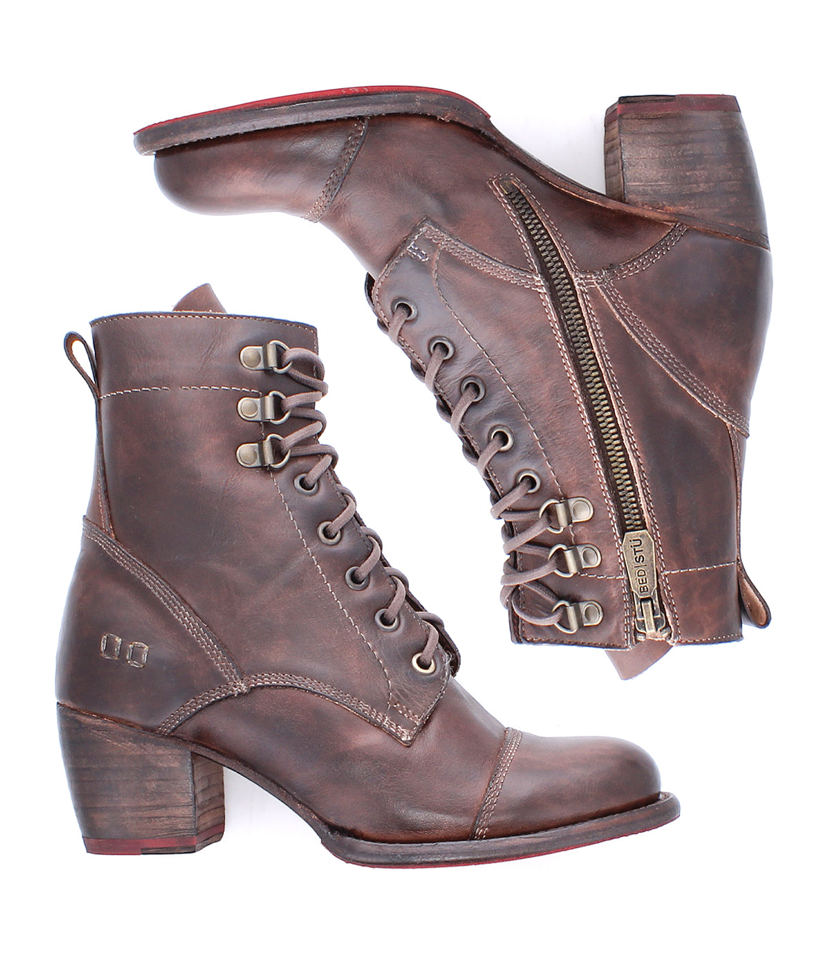 The Bed|Stü Judgement boots are a pair of brown leather lace-up ankle boots with side zippers and chunky block heels, featuring a cushioned insole for enhanced comfort. Displayed from both a side and top-down perspective, these block heel boots are shown isolated on a white background.