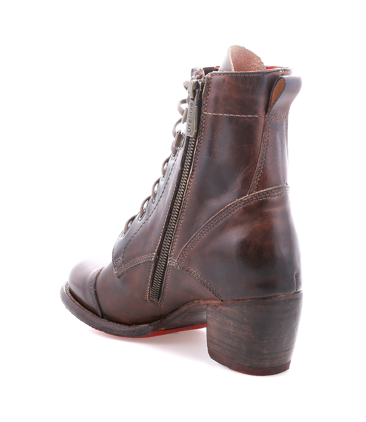 The Bed|Stü Judgement is a brown leather lace-up ankle boot with a side zipper and a chunky stacked block heel, featuring a cushioned insole for all-day comfort, shown at a three-quarter rear angle on a white background.