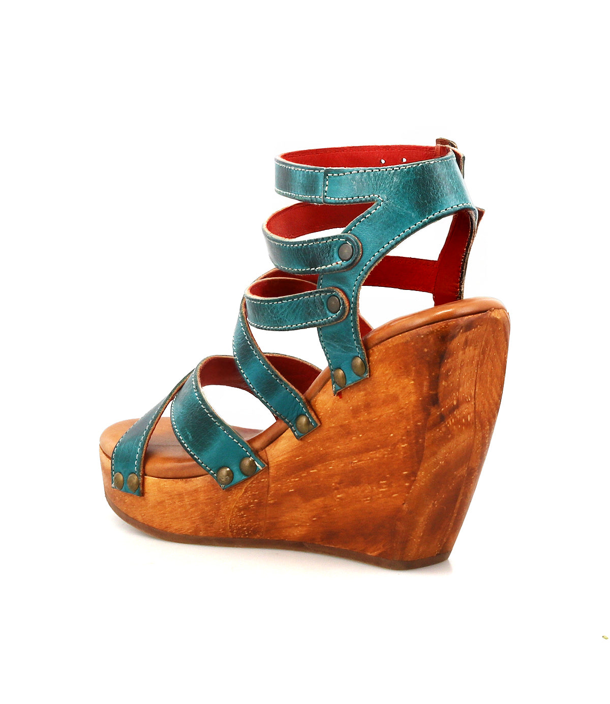 The Juliana II by Bed|Stü is a teal leather platform sandal with a strappy upper, wooden wedge sole, and an adjustable ankle strap, displayed in side profile against a white background.