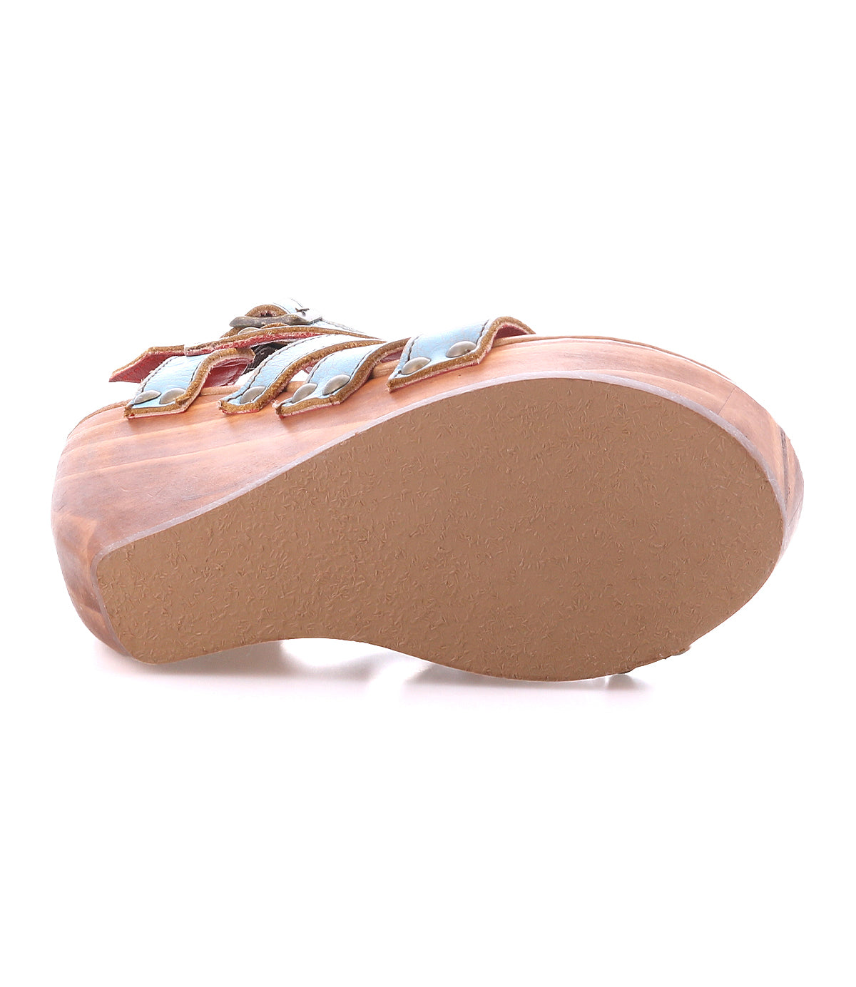 The Bed|Stü Juliana II platform sandal is displayed from the bottom, highlighting its tan textured sole and strappy upper with metallic straps against a white background.