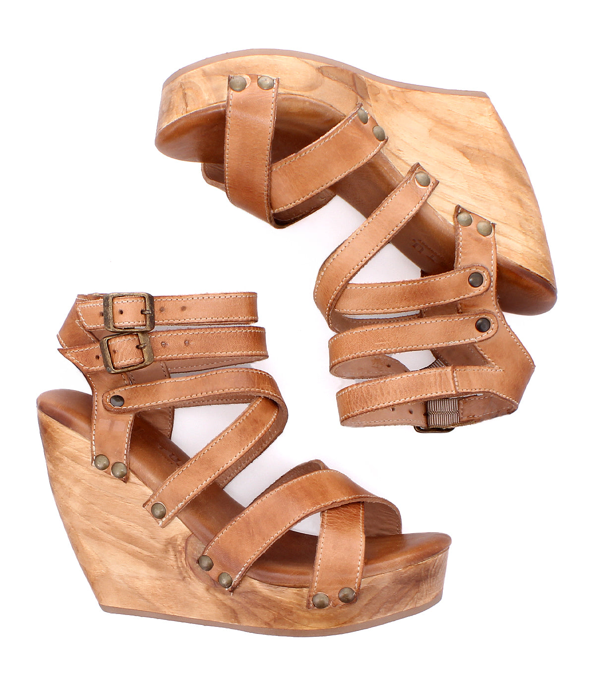 A pair of Bed|Stü Juliana II tan leather wedge sandals featuring a wooden platform, strappy upper with decorative studs, and buckle closures, shown from side and top views.