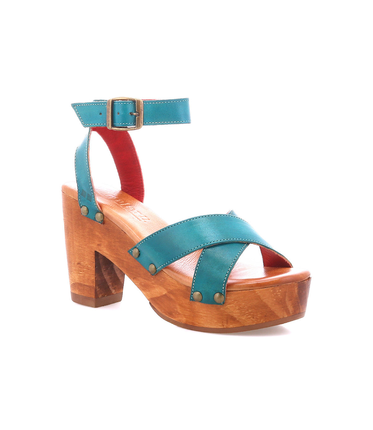 The Kalah by Bed|Stü is a wooden platform sandal featuring a sustainably sourced wooden heel, teal leather straps secured with brass rivets, and an adjustable ankle strap buckle, shown against a white background.