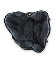 Open, empty Bed|Stü Keg black leather duffle bag viewed from above, showcasing the interior fabric lining and a zippered side pocket—crafted from premium vegetable tanned leather for lasting durability.
