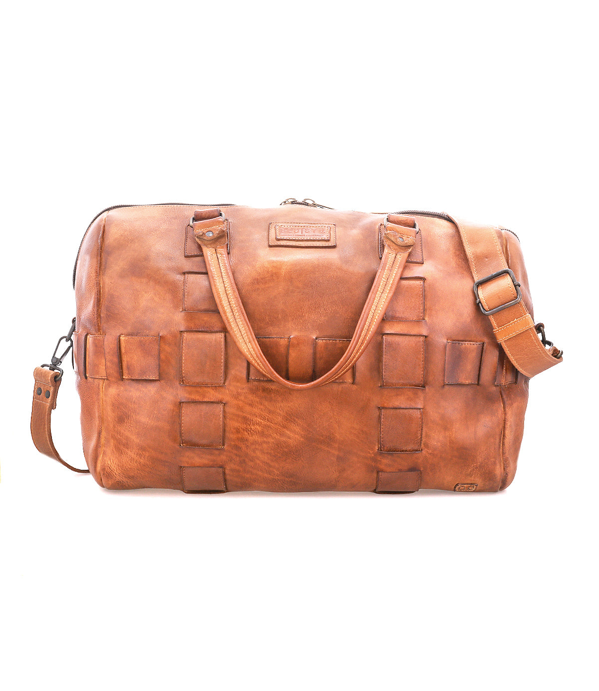 Bed|Stü Keg is a brown leather duffel bag crafted from premium vegetable tanned leather, showcasing a woven square pattern, two handles, detachable shoulder strap, and zippered top closure. Photographed against a white background, this travel bag combines timeless style with lasting durability.