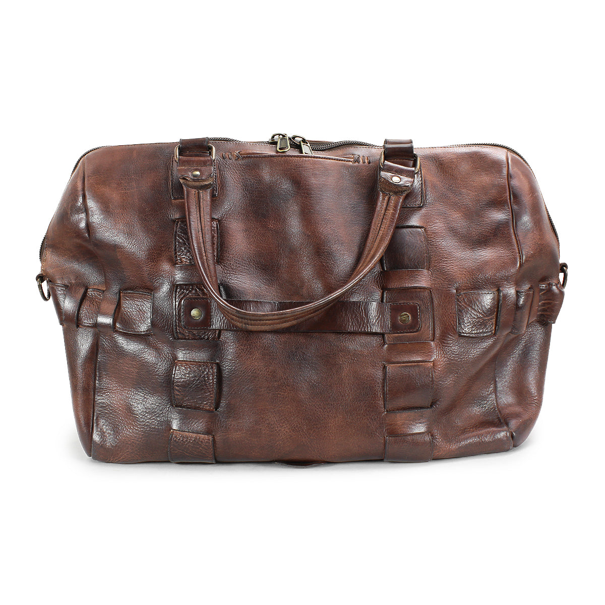 Bed|Stü Keg is a brown leather duffle bag crafted from vegetable-tanned leather, featuring dual handles, side rings for an optional shoulder strap, and a zippered top closure. This travel bag showcases a textured finish with visible stitching.