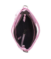 The Bed|Stü Keiki purse in pink is photographed against a white background, featuring a spacious black interior with a zipper pocket, zip-top closure, a small strap with clasp, and a fabric loop.