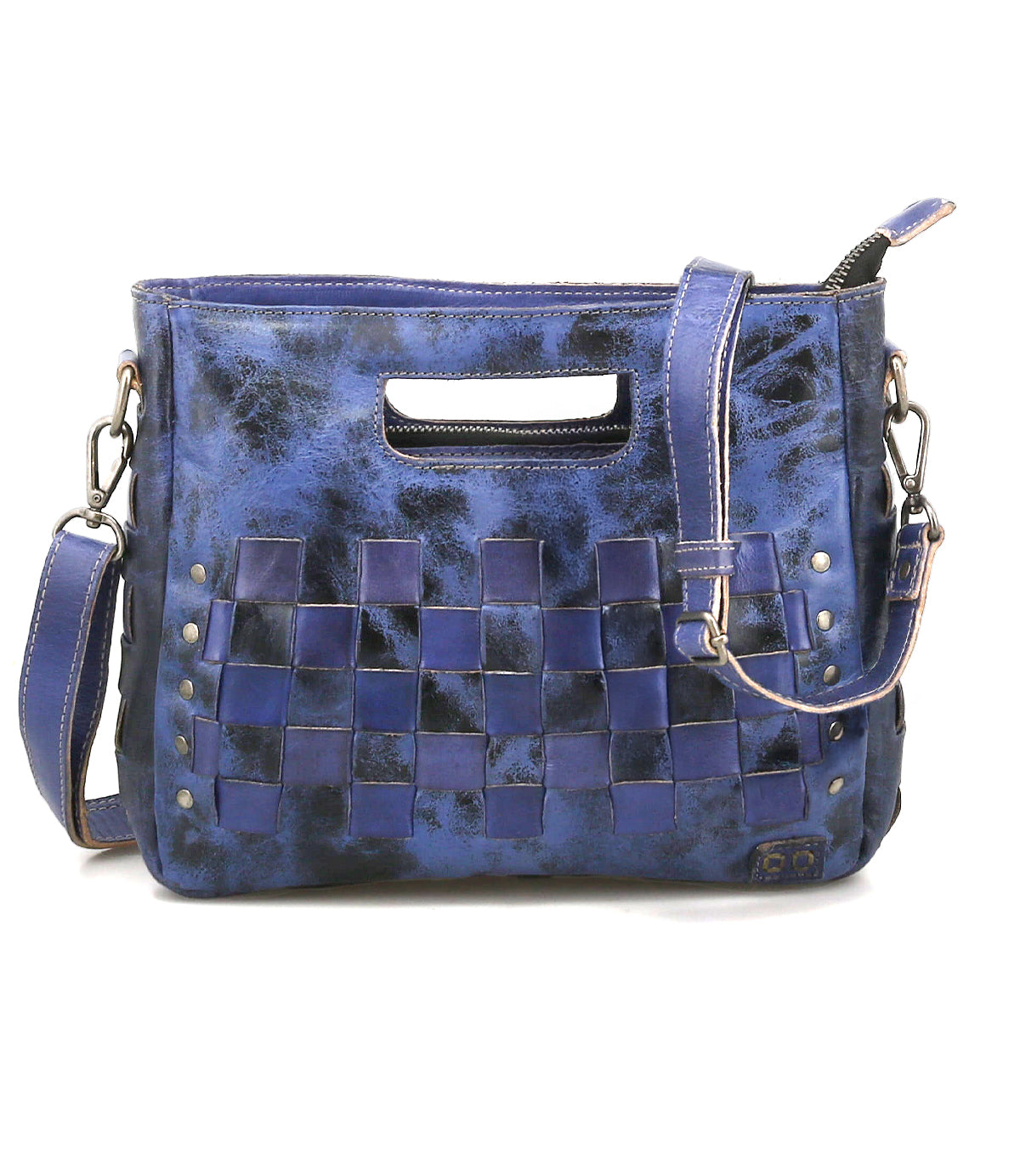 The Keiki crossbody bag by Bed|Stü features blue leather in a checkerboard pattern, adorned with metal rivets, a zip-top closure, an adjustable detachable shoulder strap, and a stylish cutout top handle.