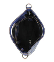 Top view of the Bed|Stü Keiki crossbody bag in blue checkerboard, featuring a zippered pocket, black interior lining, adjustable strap, and an interior metal key clip.