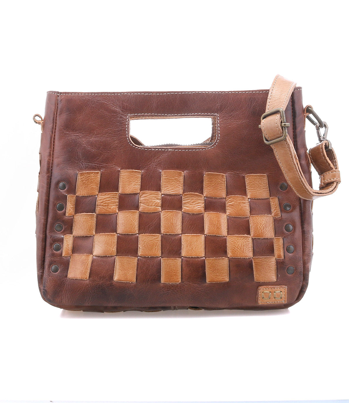 Discover the Keiki by Bed|Stü: a brown leather handbag featuring a woven light and dark checkerboard front, cutout handle, metal studs, zip-top closure, and an adjustable shoulder strap.