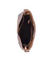 The Bed|Stü Keiki brown leather handbag is pictured from above with its zip-top closure open, showcasing a roomy, dark-lined interior highlighted by tan pocket accents.