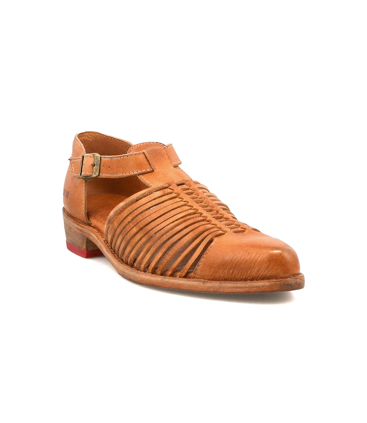 The Kenna by Bed|Stü is a brown leather closed-toe sandal featuring woven cutouts along the sides, an adjustable ankle strap with buckle, a low heel, and a small red accent on the sole.
