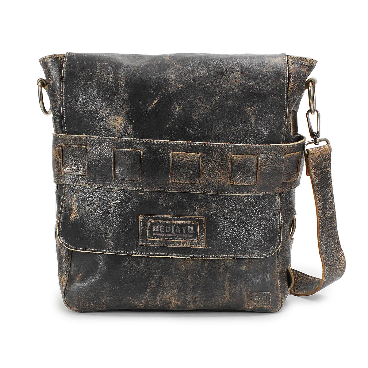 Introducing the Kure crossbody bag from Bed|Stü—a distressed brown, vegetable-tanned leather messenger featuring a front flap, square-stitched detailing, and an adjustable shoulder strap. The Kure blends classic style with Bed|Stü’s renowned durable craftsmanship, making it a versatile choice for everyday use.