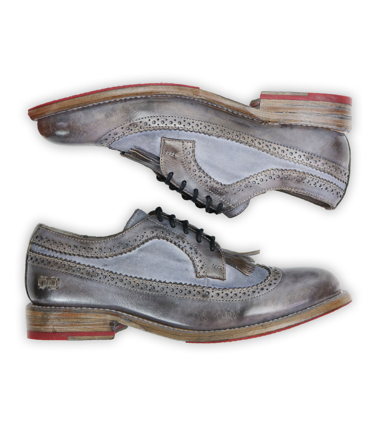 A pair of Lita K dress shoes by Bed|Stü in gray and brown, showcasing exquisite brogue details, a classic wingtip toe, and striking red accents on the soles with a stacked heel—all elegantly displayed toe to heel against a white background. This signature style seamlessly blends timeless elegance with modern flair.