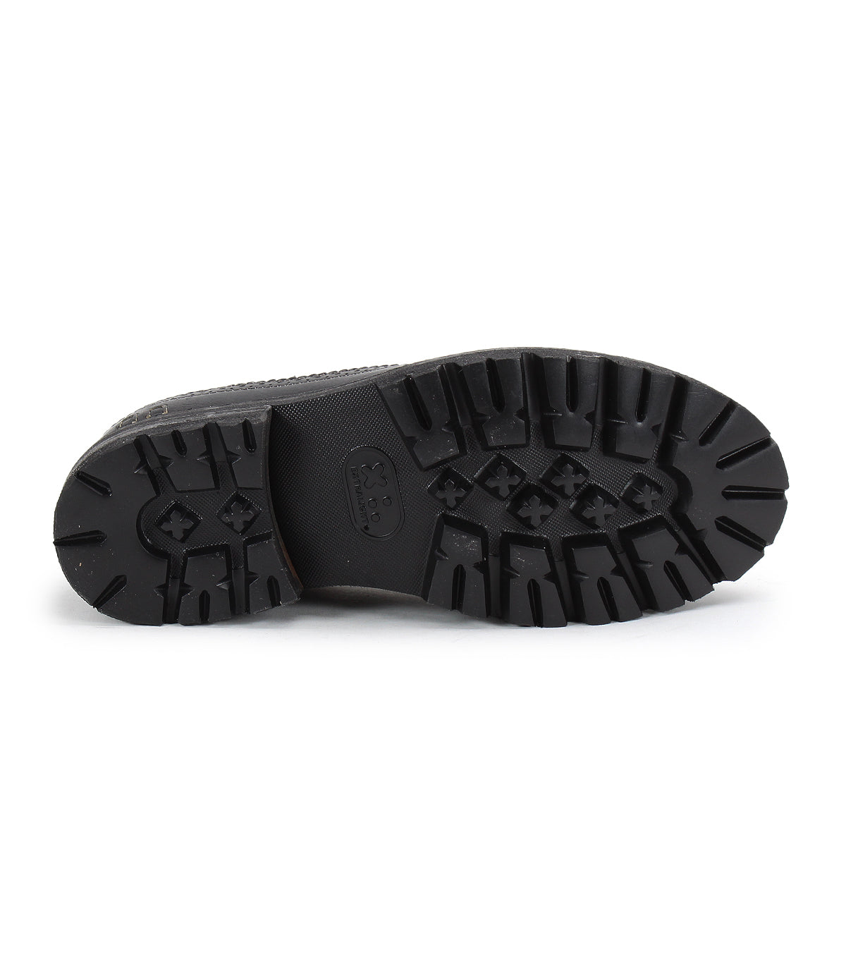 The image displays the black, patterned rubber sole of the Bed|Stü Lita K III boot, viewed from below to showcase its tread design and grip details—echoing a retro sneaker style with vintage-inspired elements in its canvas and leather construction.