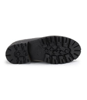 The image displays the black, patterned rubber sole of the Bed|Stü Lita K III boot, viewed from below to showcase its tread design and grip details—echoing a retro sneaker style with vintage-inspired elements in its canvas and leather construction.