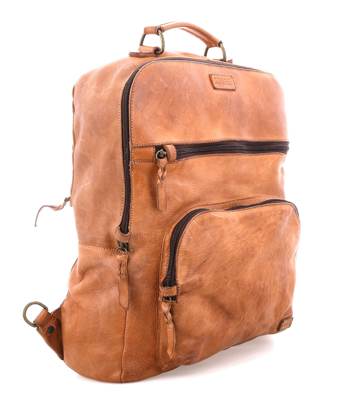 The Bed|Stü Lafe brown leather backpack features two zippered front pockets, a top handle, and metal hardware, designed as a 17-inch laptop bag that combines style and practicality—shown here on a white background.