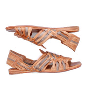 A pair of Lauren II tan and gray hand-woven leather huarache sandals by Bed|Stü is displayed side by side on a white background.