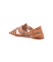 The Bed|Stü Lauren II is a brown flat huarache sandal featuring open toe and woven leather straps, displayed from a rear side angle against a white background.
