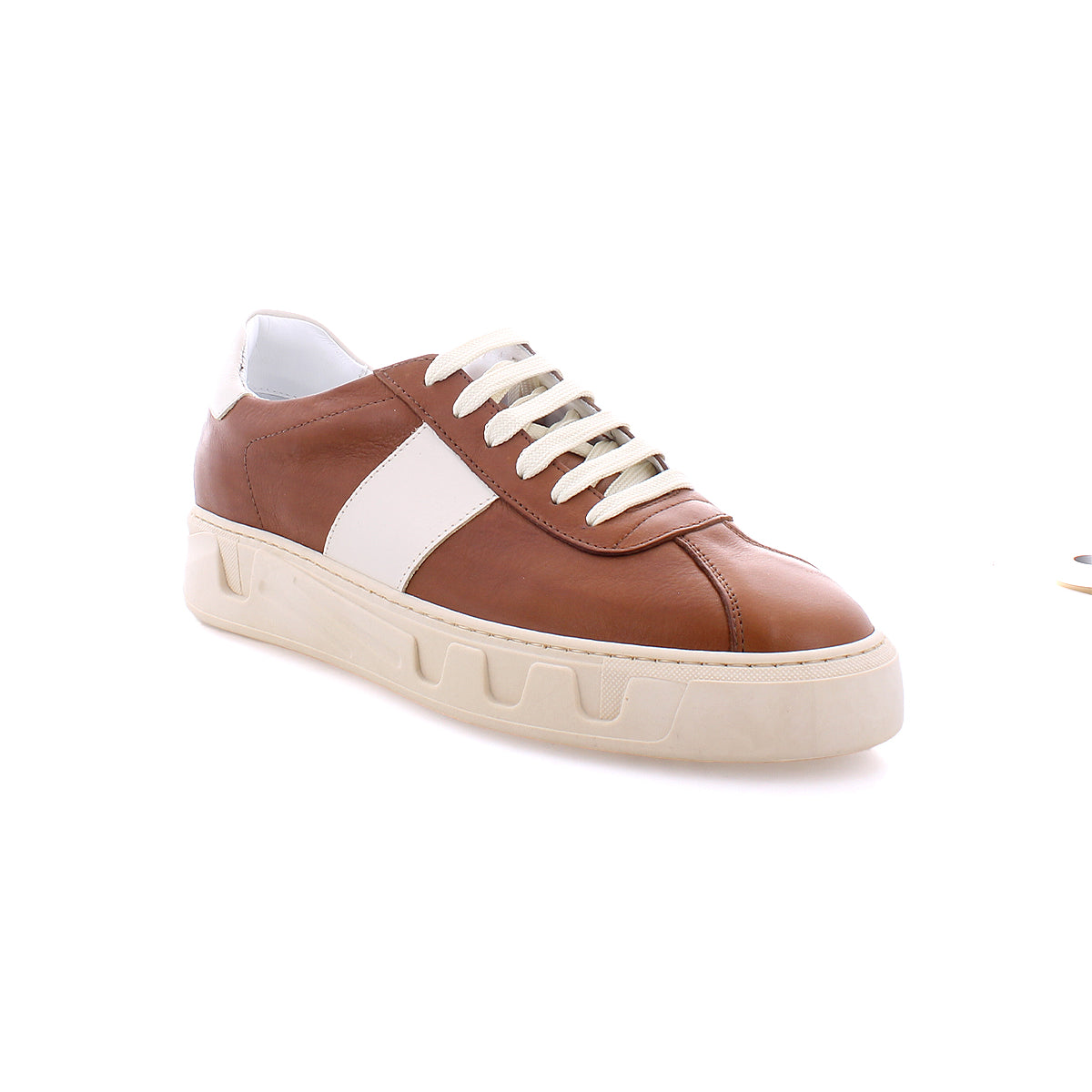 The Law sneakers by Bed|Stü are brown and white low-top luxury leather shoes featuring white laces and a thick off-white sole, expertly crafted in Italy and photographed against a white background.