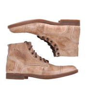 A pair of Bed|Stü Leonardo light brown lace-up leather ankle boots with low heels and a flexible rubber outsole, photographed side by side against a white background.