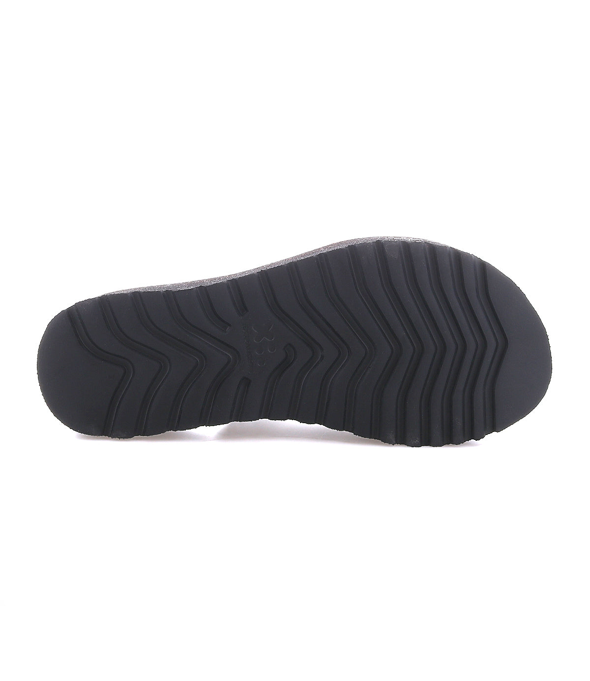The image displays the black rubber sole of the Bed|Stü Library platform sandal, featuring a zigzag tread pattern when viewed from the bottom and evoking classic ‘90s retro style footwear.