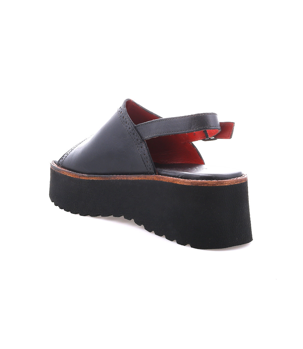 A single black "Library" platform sandal by Bed|Stü, featuring an open back, ankle strap, and thick ridged sole, is displayed on a white background—perfect for adding a touch of retro footwear to your look with its unmistakable ‘90s style.